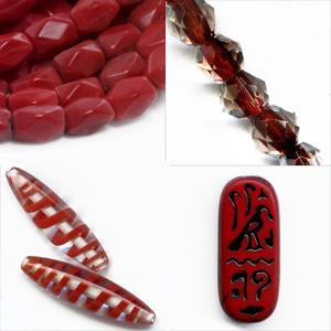 Selection of Red Beads, egyptian plaque, rhomboid, oval with spiral, clear with red center