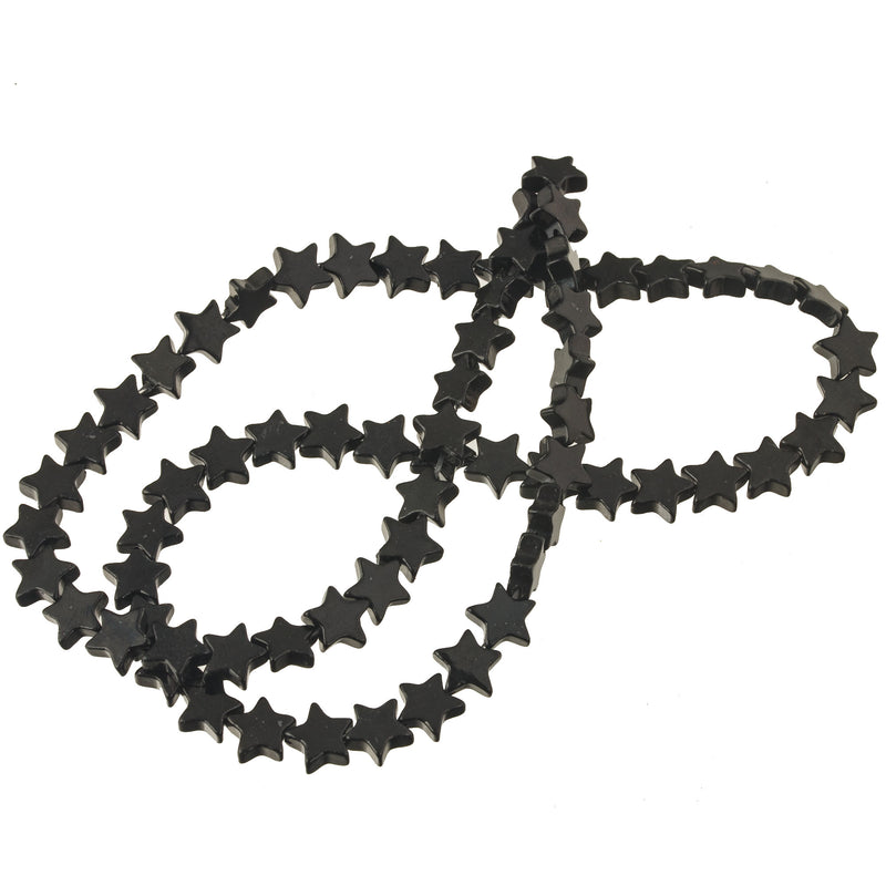 Carved  flat black onyx star beads.  7mm. Vintage stock.  15 inch strand. b4-ony312