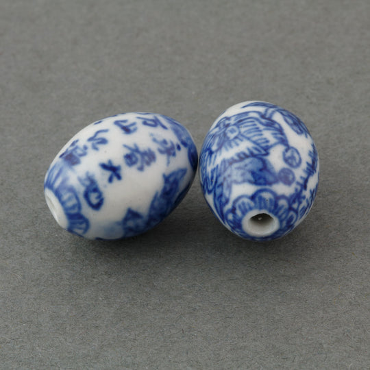 Vintage foliar Chinese white and blue porcelain oval bead with calligraphy. 18x13mm. Pkg1. B2-936