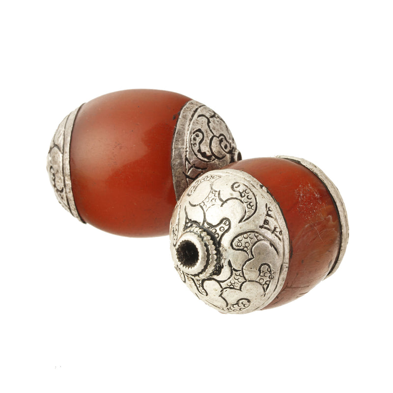 Vintage Tibetan repousse silver capped resin simulated amber bead. Avg. 33x23mm,Nepal, 1970s. 1 pc. 