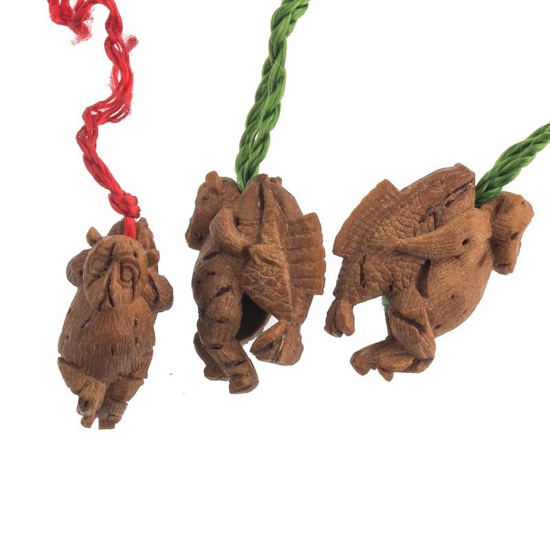Vintage fruit pit carvings of monkey carrying fish on back.  Set of 3.  