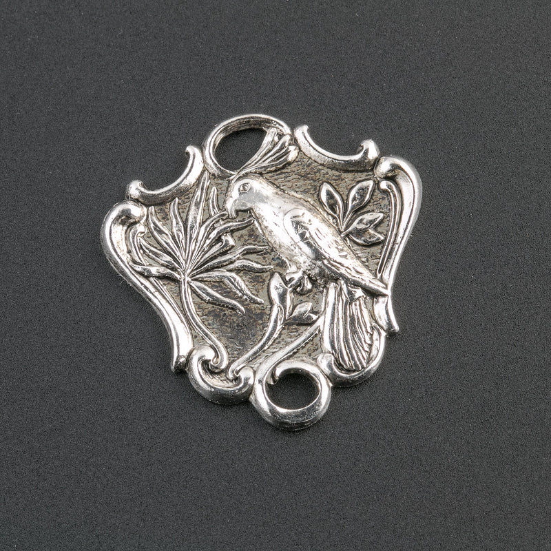 Sterling silver plated brass 2 ring connector depicting a bird on a branch. Pkg. of 2. 