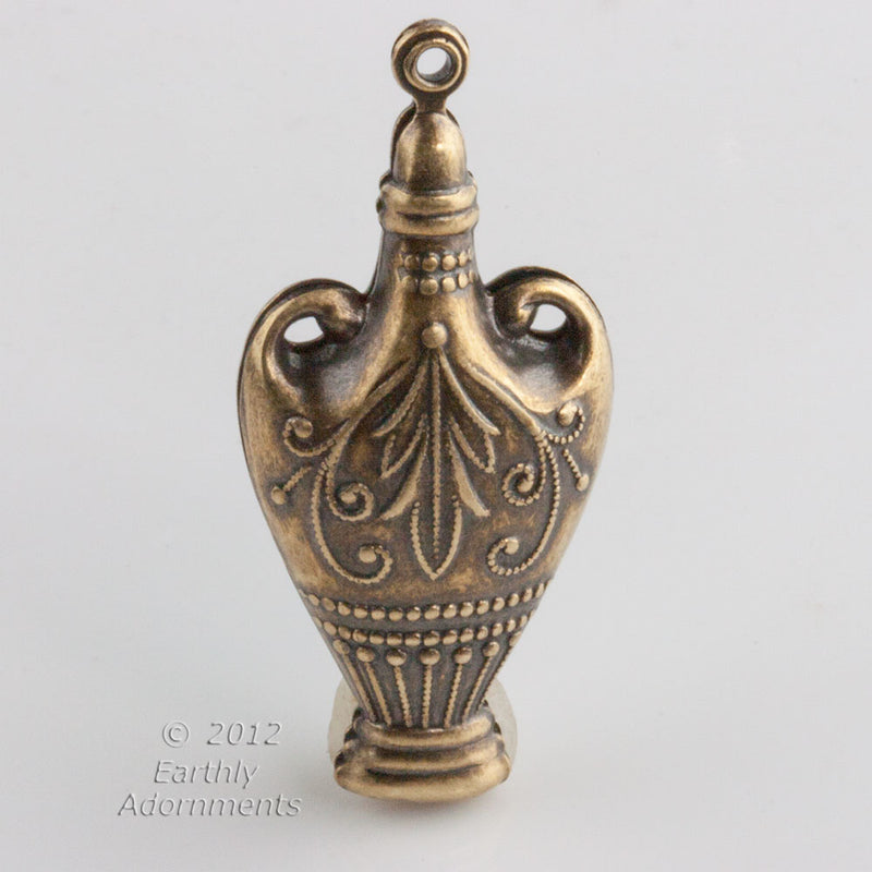 Oxidized hollow brass urn pendant 45x21x10mm. Sold individually.