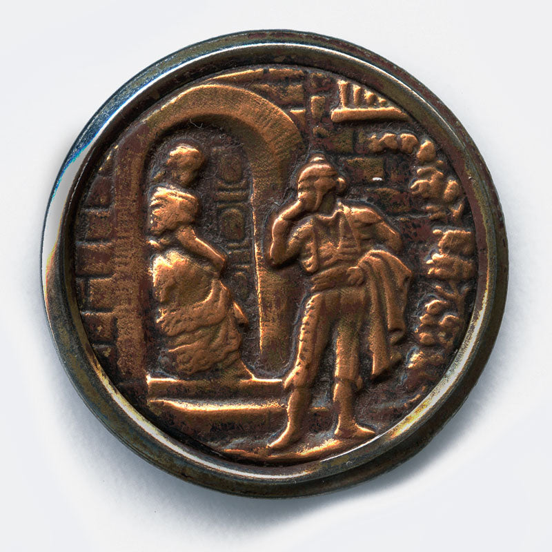 Antique stamped brass large picture button, man speaking to woman in doorway. 1.5 inches.
