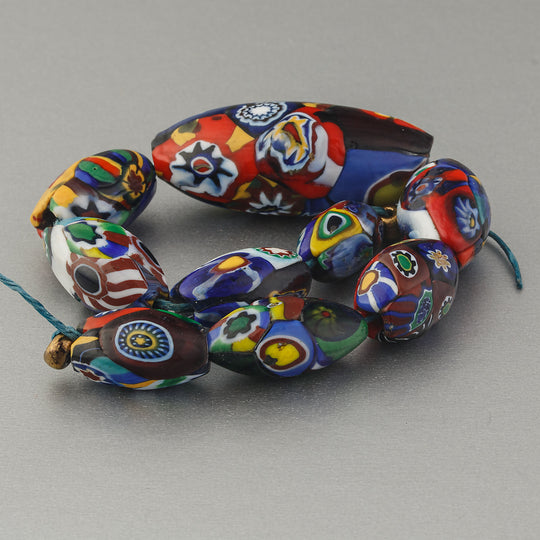 Graduated 6" strand of 9 vintage Murano millefiori glass oval beads. 1940s-1950s.  b1-3021