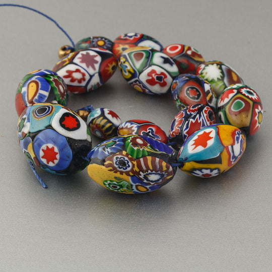 Graduated 10" strand of 15 antique & vintage Murano millefiori glass oval beads.  b1-3019