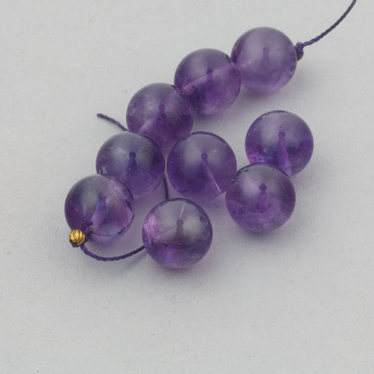 Vintage AB quality Amethyst beads in a deep purple.  10mm. 1980s.  Pkg 10. b4-ame233