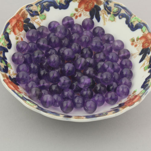 Vintage AB quality Amethyst beads in a deep purple.  10mm. 1980s.  Pkg 10. b4-ame233