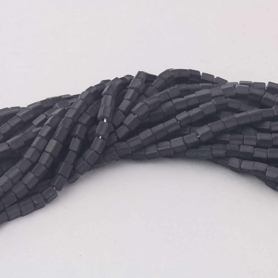 Vintage black glass pentagon beads.  4x6mm. Czechoslovakia.  16 inch strand. b11-bw-0893