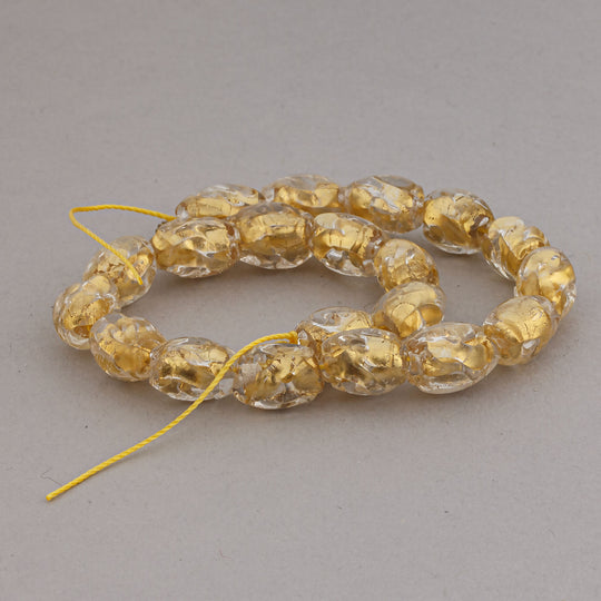 Vintage Venetian golden foil dimpled lampwork beads.±10.5x7mm, 8" strand. b11-yo-1053