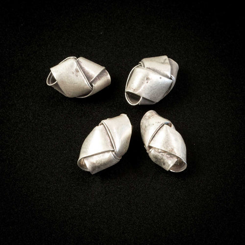 Hill tribe silver origami bead. Average 9x5mm. 0.4 grams. Pkg of 4. B18-0430