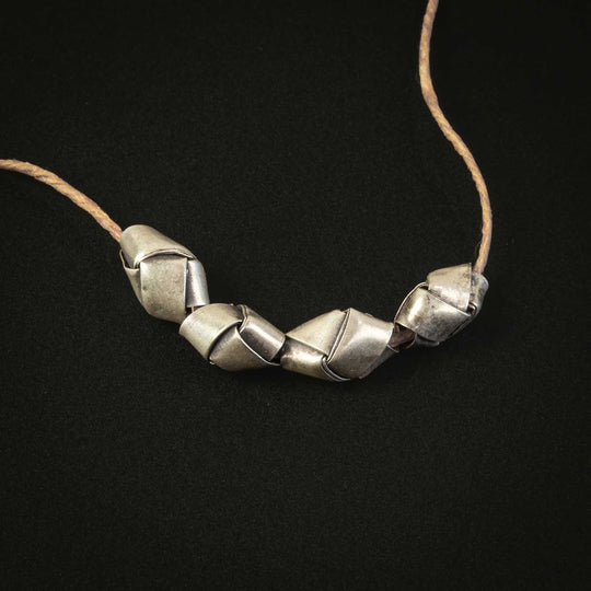 Hill tribe silver origami bead. Average 9x5mm. 0.4 grams. Pkg of 4. B18-0430