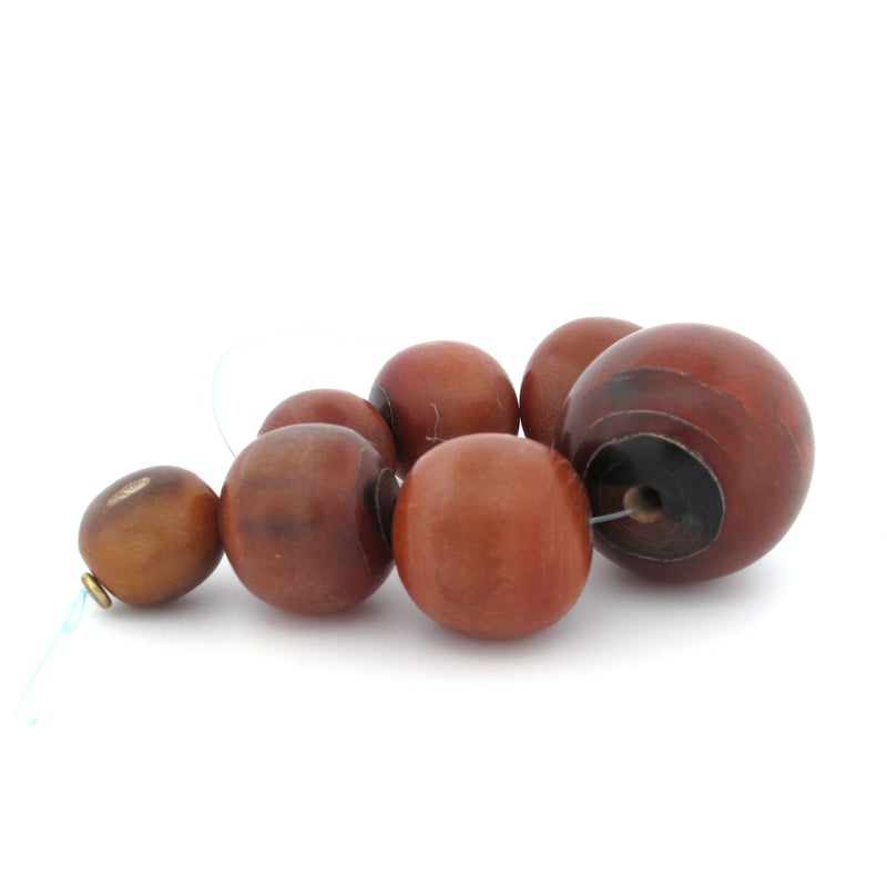 Vintage horn trade beads from West Africa.  Graduated strand of 7. 16 to 29mm. b3-ho28a