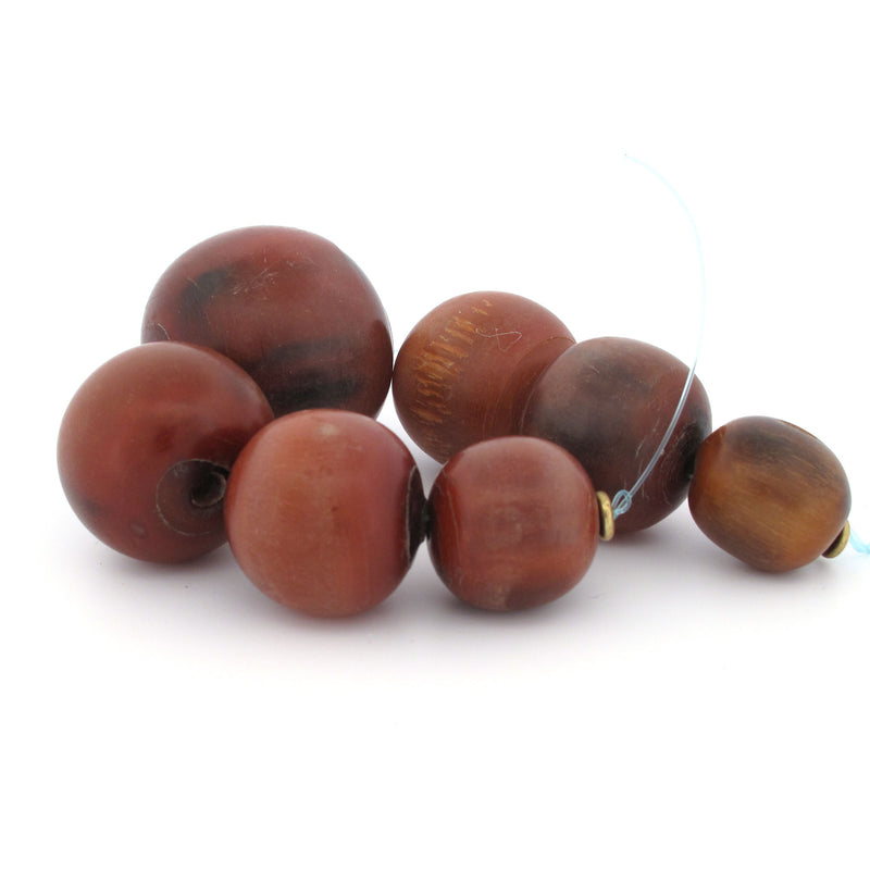 Vintage horn trade beads from West Africa.  Graduated strand of 7. 16 to 29mm. b3-ho28a