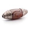 Nepali carved carnelian agate oval bead with repousse sterling silver caps. b4-car406