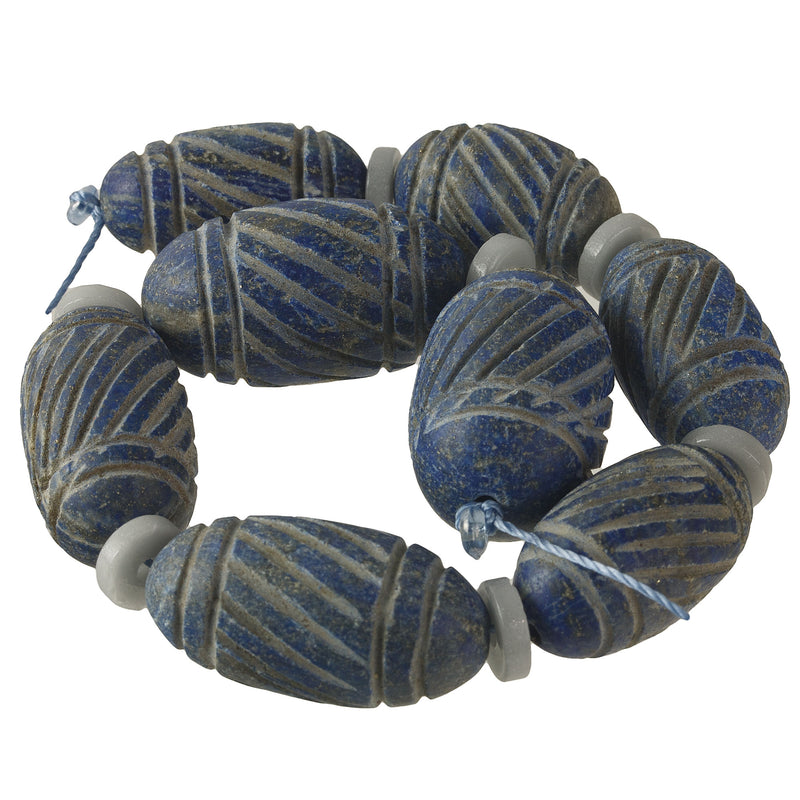 Carved Lapis Lazuli bead.  24-33x13-16mm. 1 Strand of 8 Beads. b4-lap306