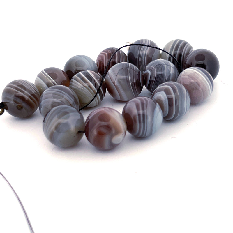 Natural Botswana agate 10mm round beads.  8 inch strand. b4-aga281