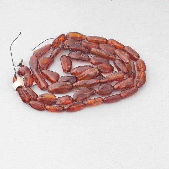 Genuine natural Baltic amber long flat ovals bead strand.  15".   B4-amb108