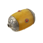 Tibetan large resin bead with repousse sterling silver caps applied coral medallions.Nepal 1970s. 41x26mm. b4-amb139
