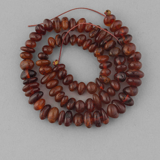 Vintage natural graduated 14" strand of Cognac Baltic Amber smooth polished freeform beads. b4-amb143