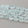 Carved Aquamarine Oval Beads, 15 inch strand. b4-aqu150