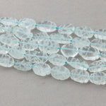 Carved Aquamarine Oval Beads, 15 inch strand. b4-aqu150