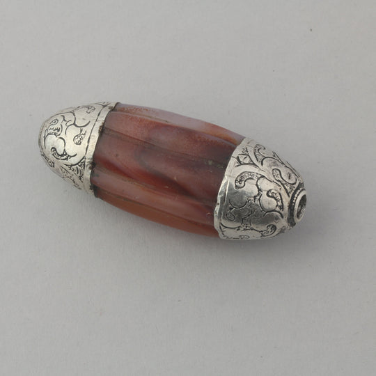 Vintage Nepal large carved carnelian agate melon bead with repousse sterling silver caps. 64x25mm.  b4-car360