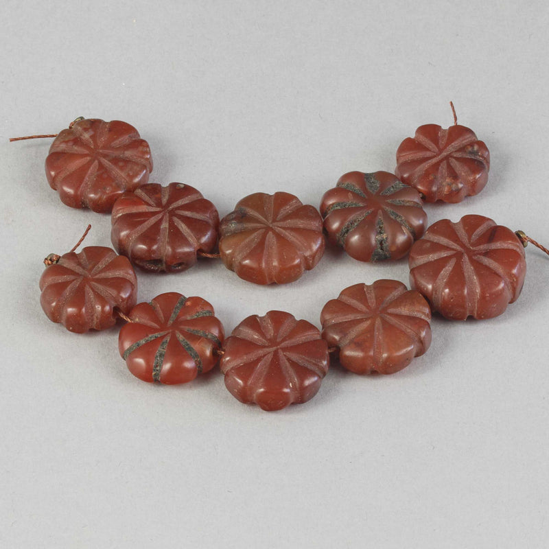 Old opaque carnelian carved flat fluted flower beads.  Strand of 5.  Nepal.  B4-car427