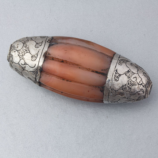 Old Tibetan agate melon bead, silver repoussé caps.  61.5mm x 28mm, Pkg 1. b4-car430