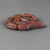 Old opaque carnelian carved oblong beads.  Strand of 11.  Nepal.  B4-car426