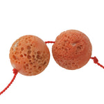 Rare beads of Japanese Momo precious coral with perforations caused by the boring-sponge. All natural. 2 beads.  7.82 grams.b4-cor462