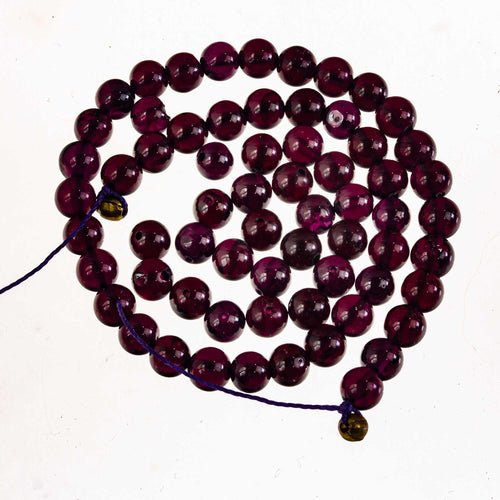 A grade hand cut Rhodolite Garnet beads. 4.5-5.5mm.40 beads