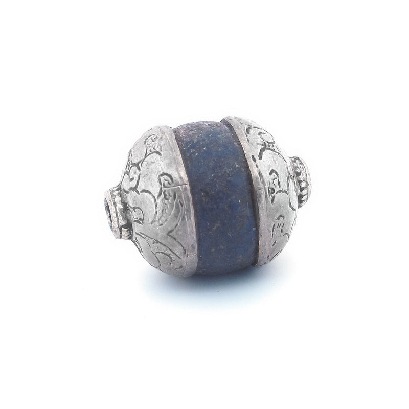 Antique Tibetan carved lapis bead with repousse sterling silver caps. Average 23x17mm. b4-lap294