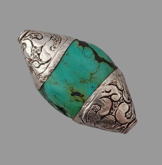 Vintage Tibetan natural  turquoise bead with repousse sterling silver caps.  53x32x15mm. b4-tur462