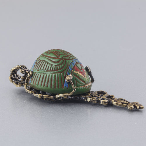 Egyptian Revival vintage Czech pressed glass and stamped brass filigree pendant. b5-555pd