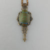 Egyptian Revival vintage Czech pressed glass and stamped brass filigree pendant. b5-555pd
