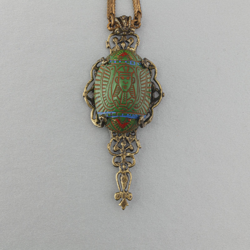 Egyptian Revival vintage Czech pressed glass and stamped brass filigree pendant. b5-555pd