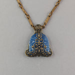 Pendant of 1920s Art Deco blue Bohemian blue glass stone wrapped in vintage brass filiigree. b5-747pd