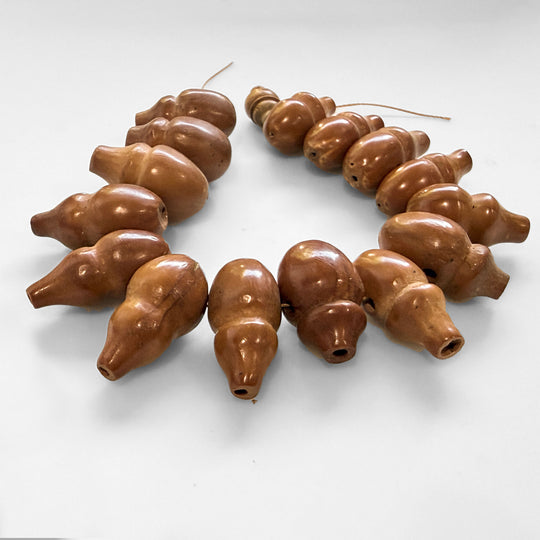 Strand of 16 hand carved gourd beads,  8".  1940s. b7-wo361