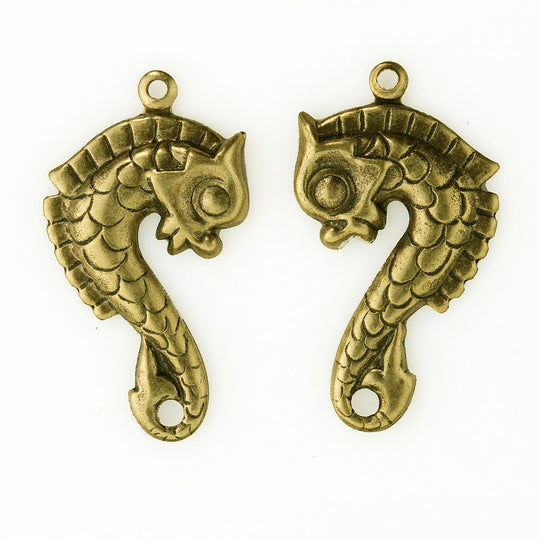 Antique finish gold plated brass medieval stamped sea horse charms. 30x16mm. Sold as 1 facing pair. b9-2384