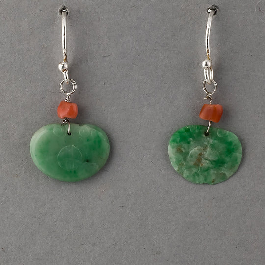 Earrings of antique carved green jade ornaments and deep salmon coral beads. erja888