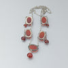 Art Deco style necklace of prong set Carnelian stone links and silver chain. nlad1000