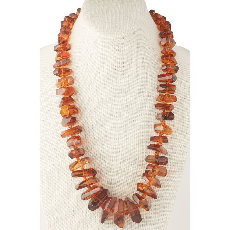 The Fossilized Baltic Amber Pendant - Hammacher Schlemmer