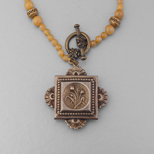 Victorian brass fob necklace strung with vintage Japanese mustard yellow glass and brass accent beads. 16.25 inches.  .  NLBD2254
