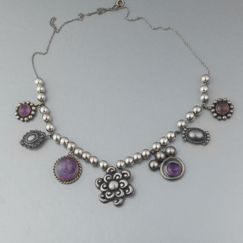 Southwestern Amethyst and sterling silver concho necklace. nlvs751