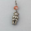 Antique Chinese Qing Dynasty hollow coin silver child charm with carnelian bead. pdvs1006