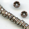Clear rhinestone rondelle with antiqued copper. 6mm. Pkg of 4. 