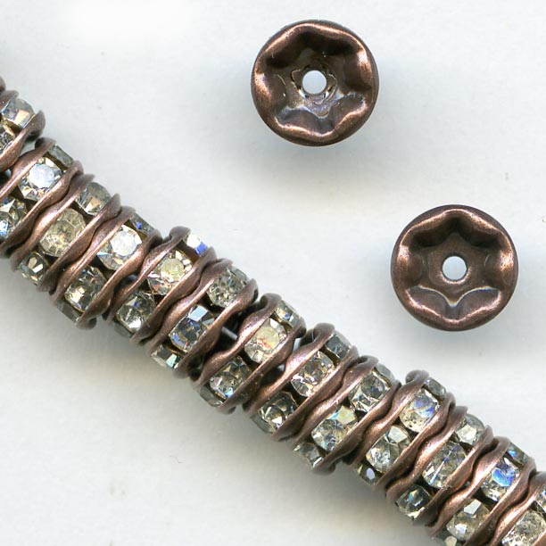 Clear rhinestone rondelle with antiqued copper. 4.5mm. Pkg of 4. 