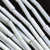 Antique Venetian opaque white bugles. 16mm. Per strand. b17-077