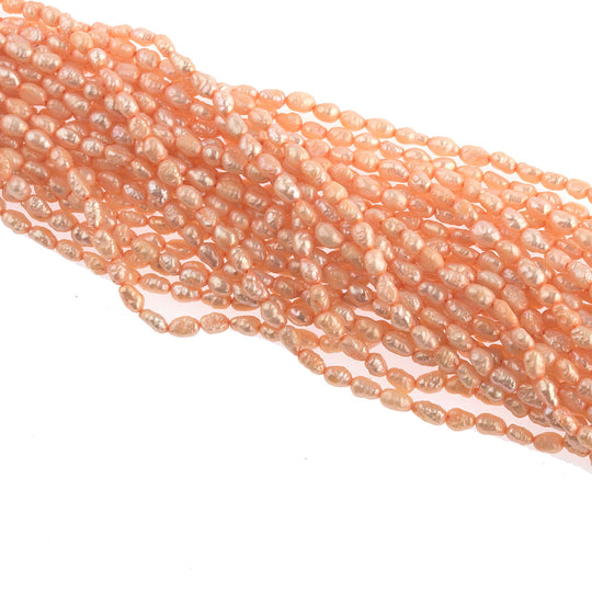 Vintage color treated iridescent freshwater oval rice pearl. Avg. 5x3mm, 16 inch strand. b15-prl115